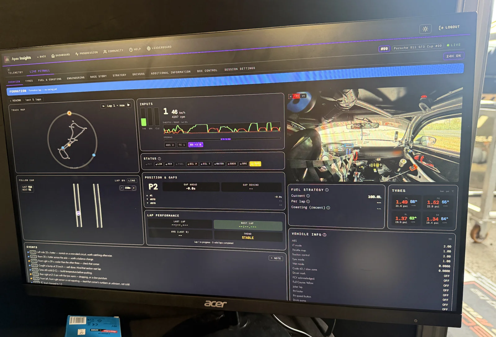 The Apex Insights live pitwall on a monitor trackside, telemetry beside onboard video